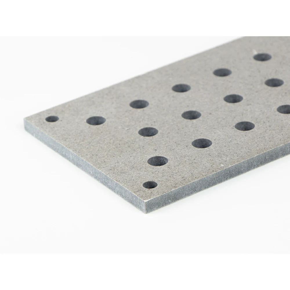 Close view of drilled holes in a mica insulation plate